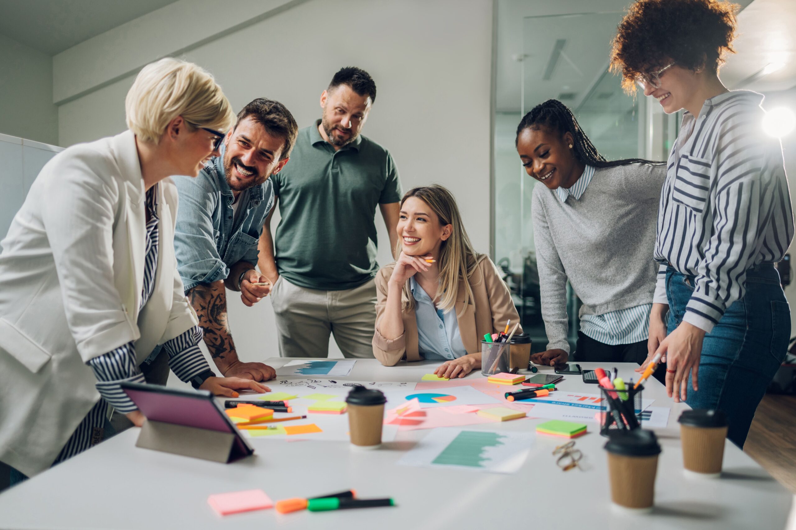 multiracial_business_team_meeting_modern_bright_office_b8f28bef44